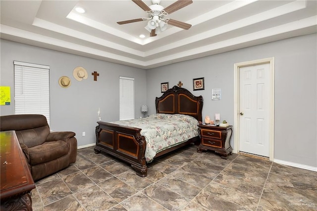 6800 N 35th St, Mcallen, TX 78504 - bedroom featuring baseboards, stone finish floor, recessed lighting, a tray ceiling, and a ceiling fan