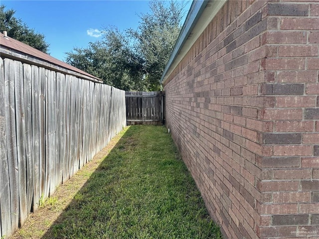 view of side of property featuring a yard