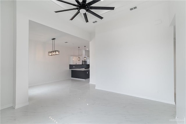 unfurnished living room with ceiling fan