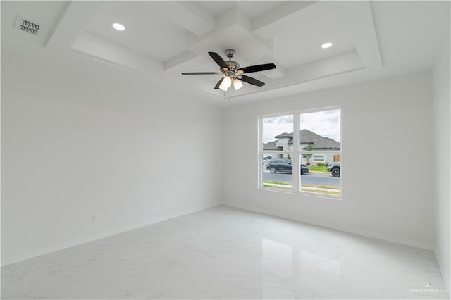 empty room featuring beam ceiling and ceiling fan