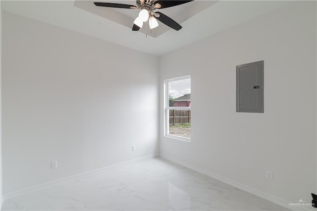 empty room featuring ceiling fan and electric panel