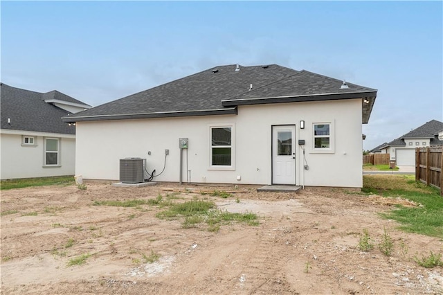 back of property featuring cooling unit