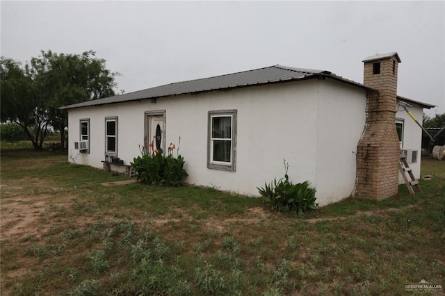 view of home's exterior with a yard