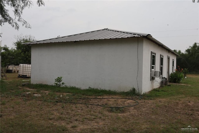 view of side of home featuring cooling unit