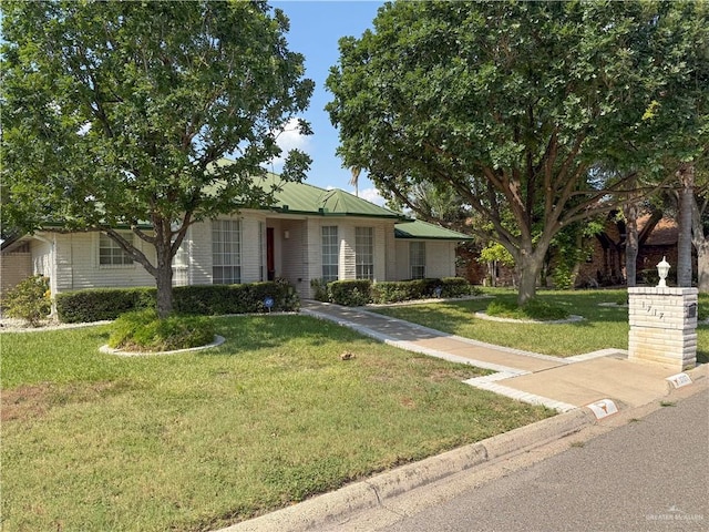 1717 Edward Dr, Edinburg, TX 78539 - ranch-style house featuring a front lawn