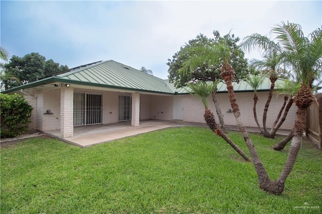 1717 Edward Dr, Edinburg, TX 78539 - rear view of property with a standing seam roof, a patio, and metal roof
