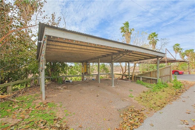 view of parking / parking lot with a carport