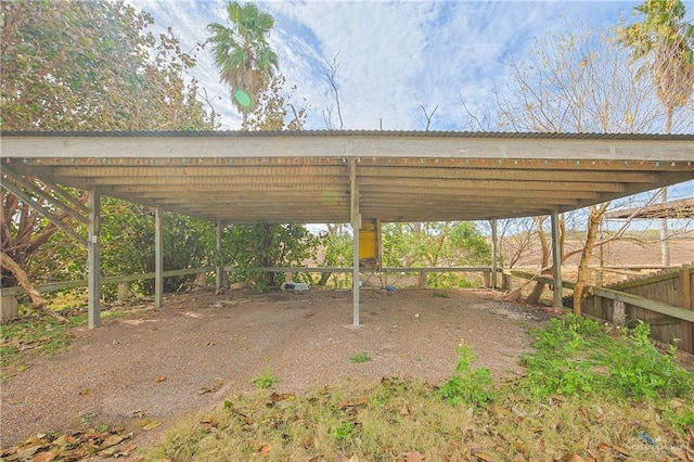 view of parking / parking lot with a carport