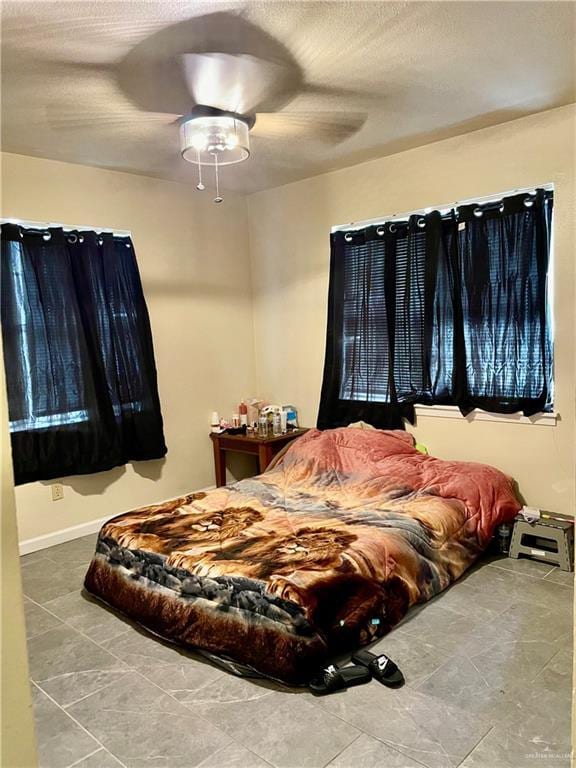 bedroom featuring ceiling fan