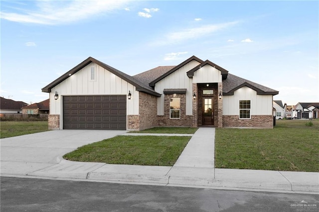 modern farmhouse style home with a front yard and a garage