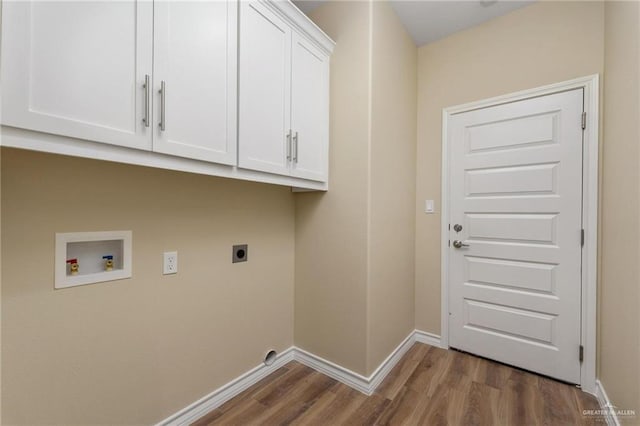 laundry area featuring electric dryer hookup, hookup for a washing machine, dark wood-type flooring, and cabinets