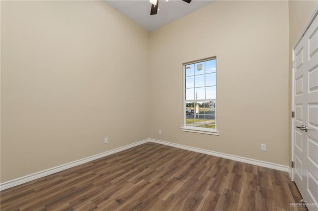 spare room featuring ceiling fan and dark wood-type flooring