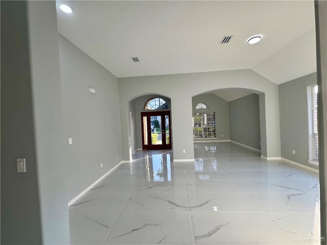 foyer entrance with lofted ceiling