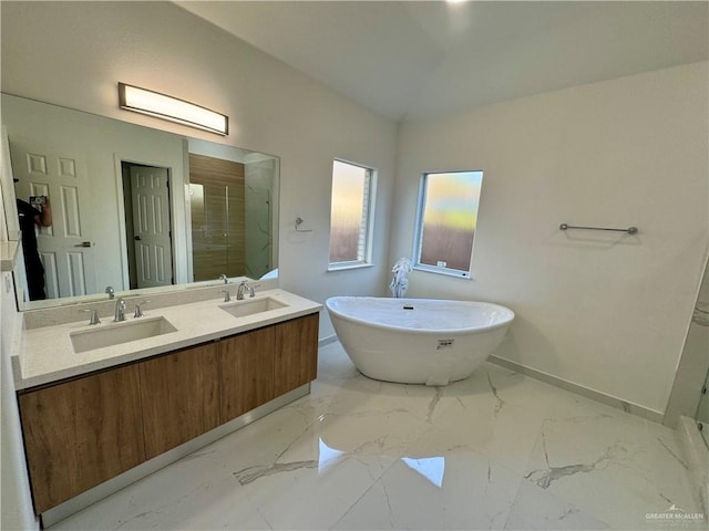 bathroom featuring independent shower and bath, vaulted ceiling, and vanity