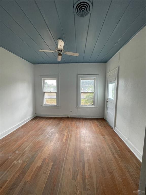 empty room with hardwood / wood-style flooring and ceiling fan