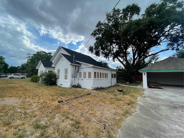 view of property exterior with a carport