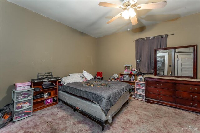 bedroom with light carpet and ceiling fan