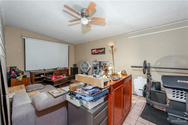 tiled cinema room featuring ceiling fan