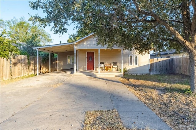 view of front of property with a carport