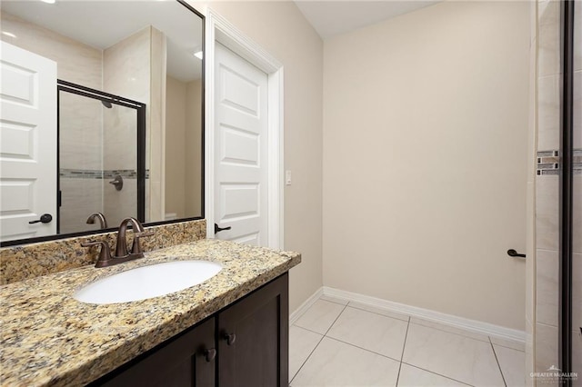 109 Aaron St, Mercedes, TX 78570 - full bathroom featuring vanity, baseboards, and tiled shower