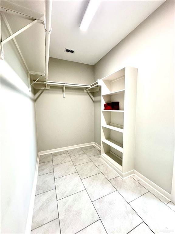 walk in closet featuring tile patterned floors