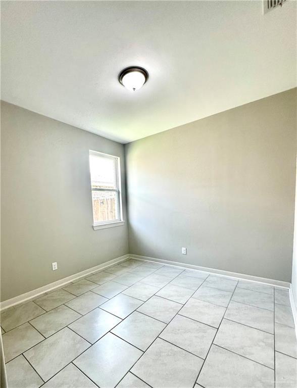 view of tiled spare room