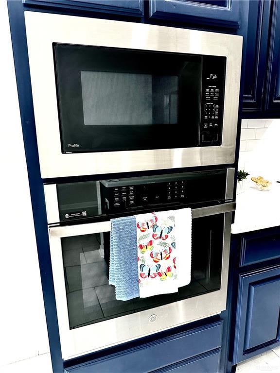 details with blue cabinetry and oven