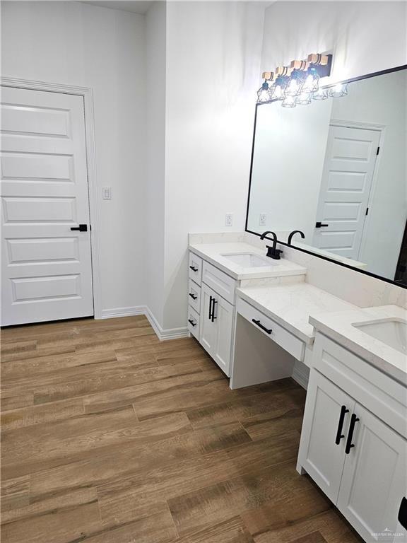 bathroom featuring vanity and hardwood / wood-style floors