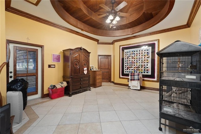 sitting room featuring ceiling fan, light tile patterned floors, a raised ceiling, and wood ceiling