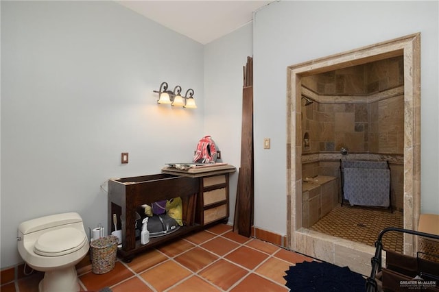 bathroom featuring toilet, walk in shower, and tile patterned floors