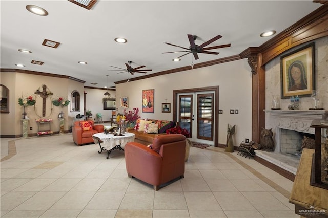 living room featuring a fireplace, crown molding, ceiling fan, and light tile patterned flooring