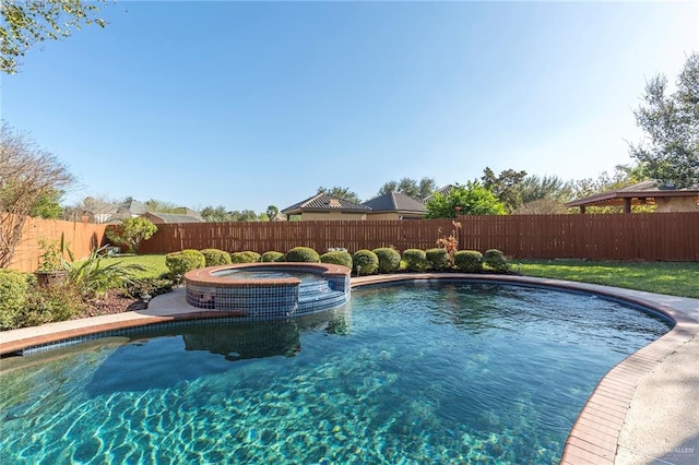 view of pool with an in ground hot tub