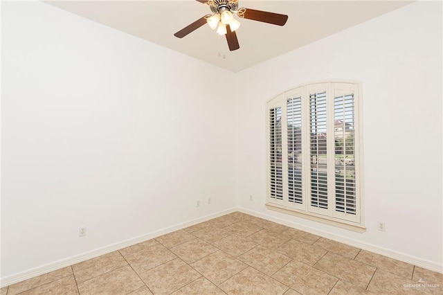 empty room featuring ceiling fan and light tile patterned floors