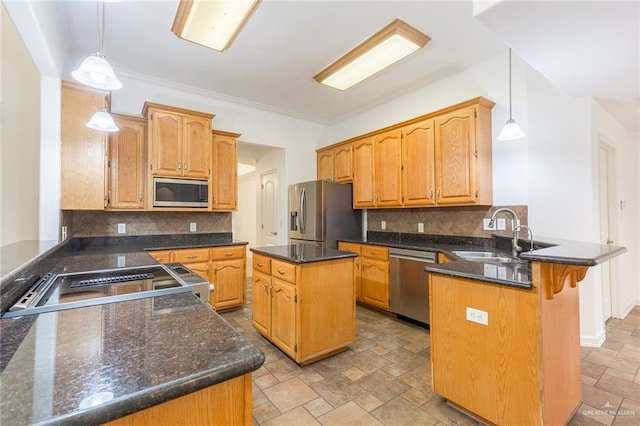 kitchen with pendant lighting, a center island, kitchen peninsula, and appliances with stainless steel finishes