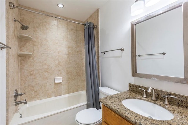 full bathroom featuring toilet, vanity, and shower / tub combo with curtain