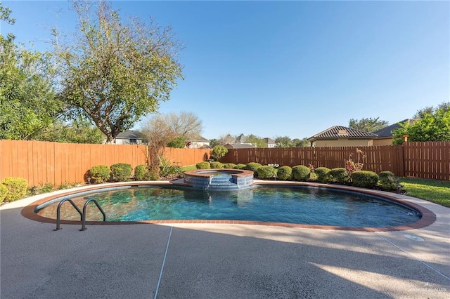 view of swimming pool featuring an in ground hot tub and a patio