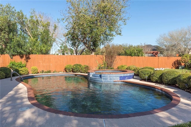 view of pool with an in ground hot tub