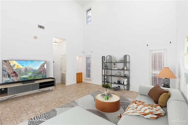 living room with a towering ceiling