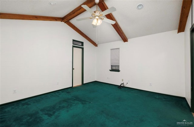 carpeted empty room with ceiling fan and lofted ceiling with beams