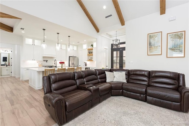 living room featuring light wood-style flooring, beamed ceiling, french doors, high vaulted ceiling, and recessed lighting