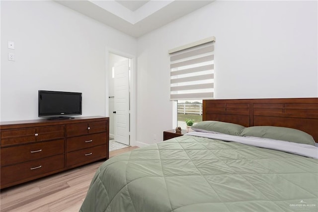 bedroom with light wood-style flooring