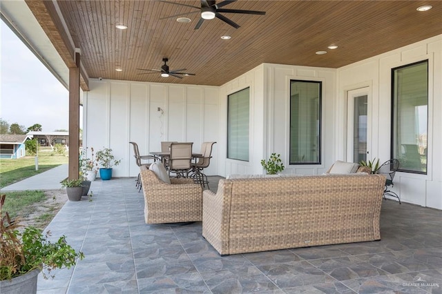 view of patio / terrace with outdoor dining area, ceiling fan, and an outdoor hangout area