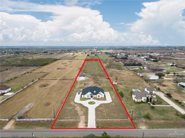 birds eye view of property featuring a rural view