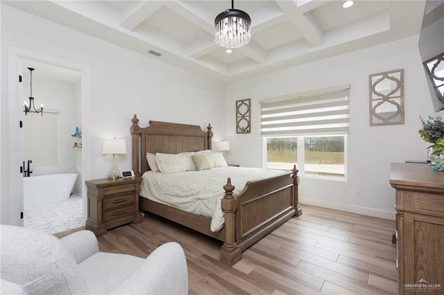 bedroom with visible vents, coffered ceiling, a notable chandelier, light wood-style floors, and beam ceiling