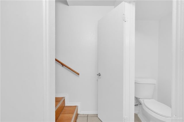 bathroom with tile patterned floors and toilet