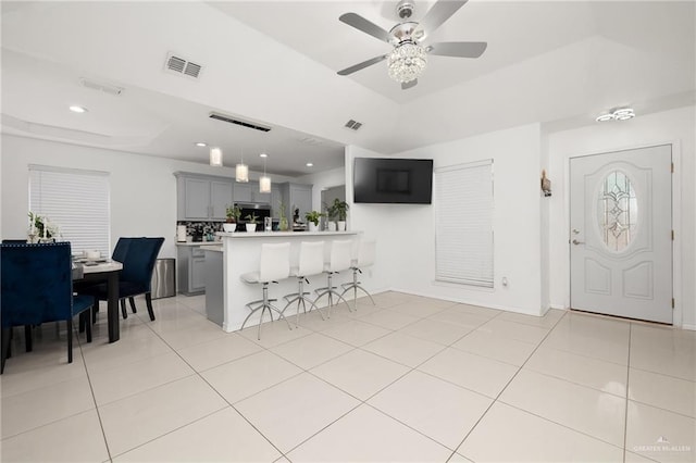 3408 Whiskey Dr, Pharr, TX 78577 - entryway with a tray ceiling, ceiling fan, light tile patterned flooring, and recessed lighting