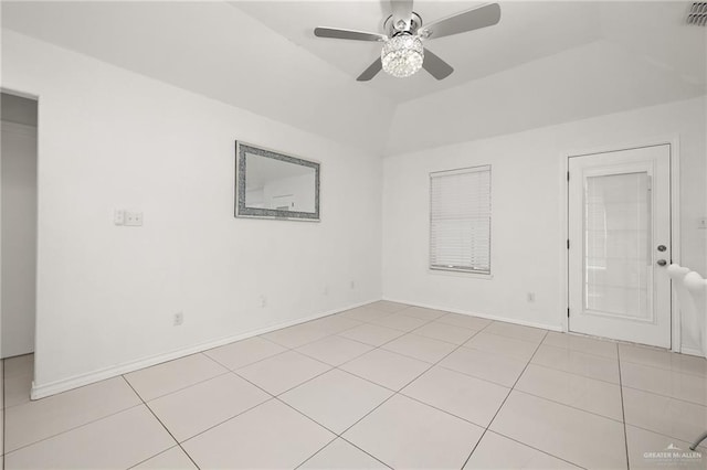3408 Whiskey Dr, Pharr, TX 78577 - empty room with light tile patterned floors, a ceiling fan, vaulted ceiling, and baseboards