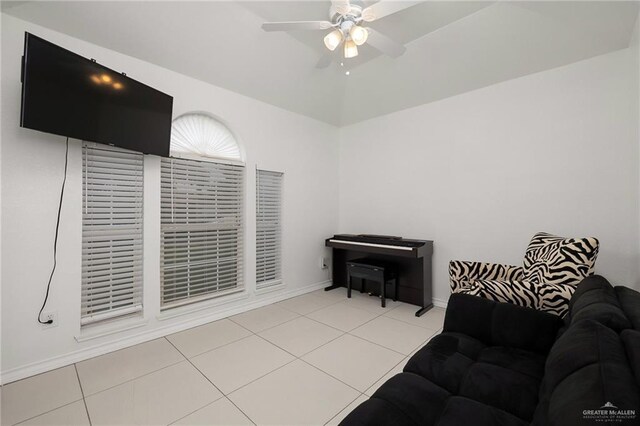 3408 Whiskey Dr, Pharr, TX 78577 - tiled living room with ceiling fan and baseboards