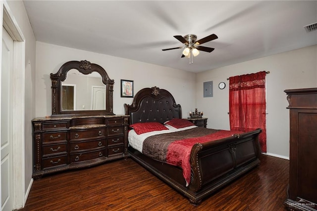 bedroom featuring dark wood-style flooring, baseboards, visible vents, and ceiling fan