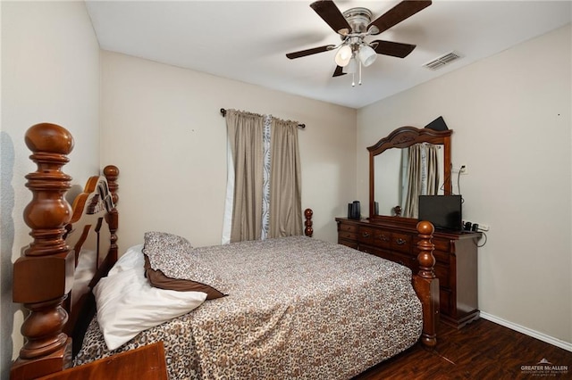 bedroom with visible vents, a ceiling fan, baseboards, and dark wood-style floors